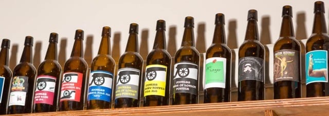 Labelled beer bottles on a shelf
