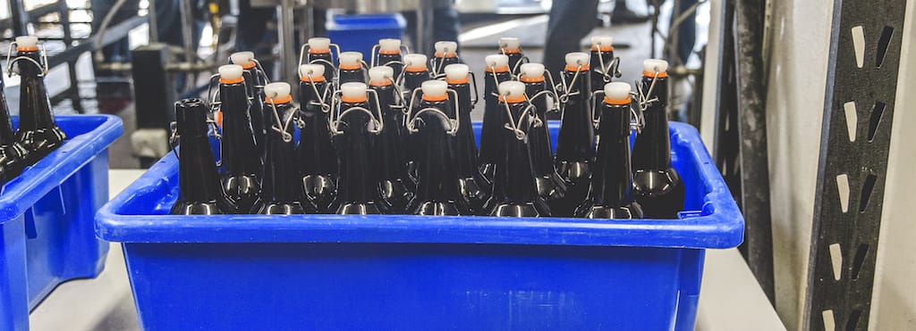 Bottles just filled with fresh beer.